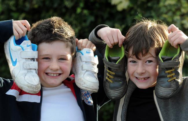 Friends Joe Williams, left, aged eight, and Dan Oglesby, aged nine, after their charity fundraising run