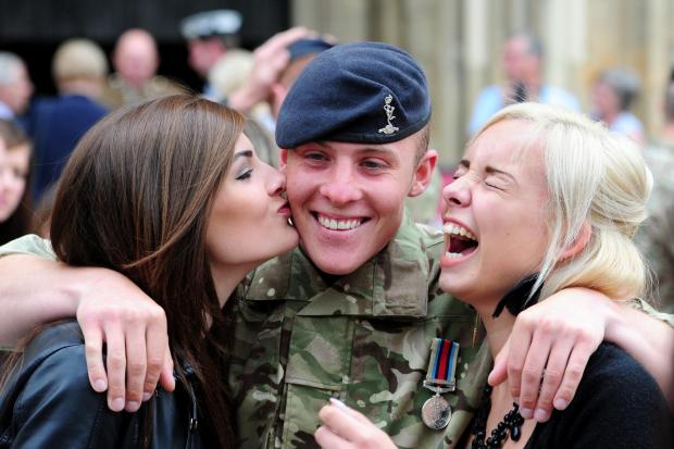 Lee Treadwell is congratulated by his sister and girlfriend after receiving his Afghanistan Medal at York Minster