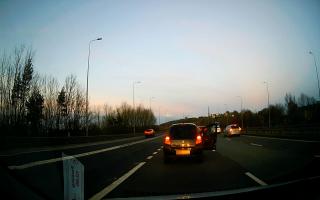 The moment the driver got out on the busy M62