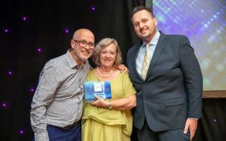 Christopher Hall from Drive presenting the School of the Year award to Jonathan Green and Anne Clark from Naburn CE School