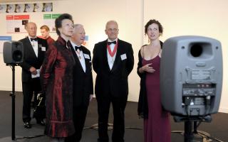 Princess Anne talks to Dr Helena Daffern, with the Royal Academy of Engineering president, Sir John Parker, second left, and Prof Brian Cantor, the University of York’s Vice-Chancellor, in a surround sound area at the exhibition