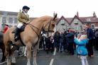 A youngster takes a picture of the Middleton Hunt meet in Malton Market Place on Boxing  Day
