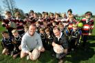 Evening Standard rugby union writer Chris Jones, pictured right with Malton & Norton juniors and England rugby union coach Stuart Lancaster, has written a book on Twickenham, the home headquarters of the English game