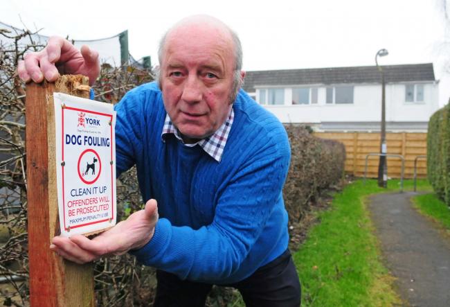 Ian Hudson has put up signs to warn owners of the consequences if they fail to clear up after their dogs