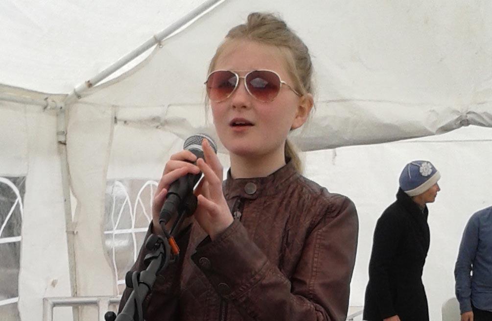 Maggie Wakeling, 10, sings at the Bishy Road Street Festival