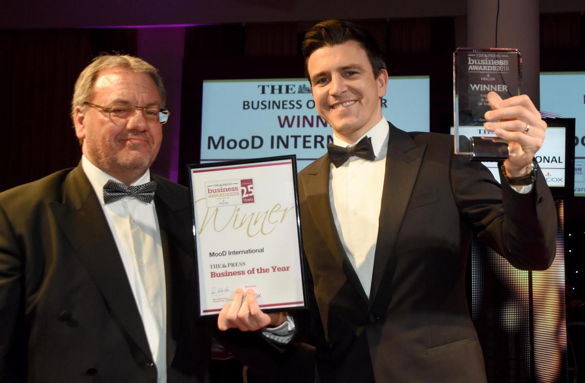 The Press Business Awards 2015. The Press Business of the Year Award winner MooD International. Nick Cowlen receives the award from Perry Austen-Clarke from The Press. Picture David Harrison.