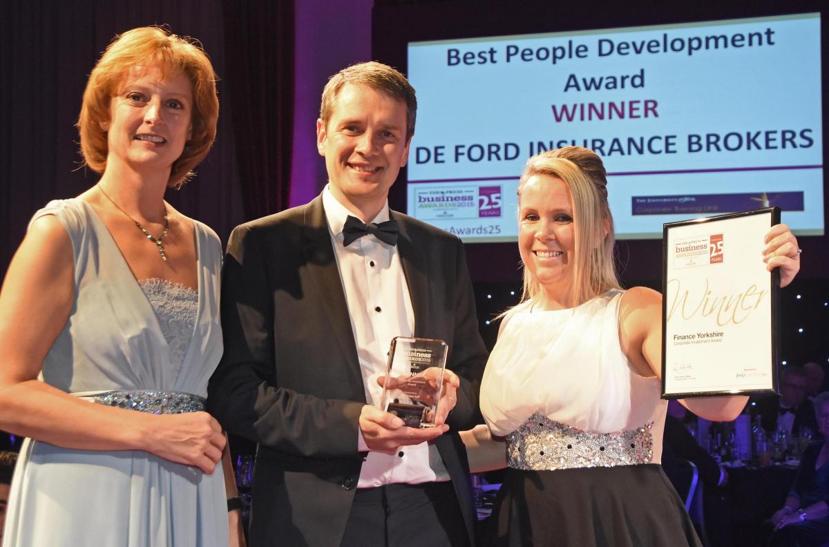 The Press Business Awards 2015. Best People Development Award winner De Ford Insurance Brokers. Craig Walton and Laura Chappell receive the award from Amanda Selvaratnam, left, from Uni of York Corporate Training Unit. Picture David Harrison.