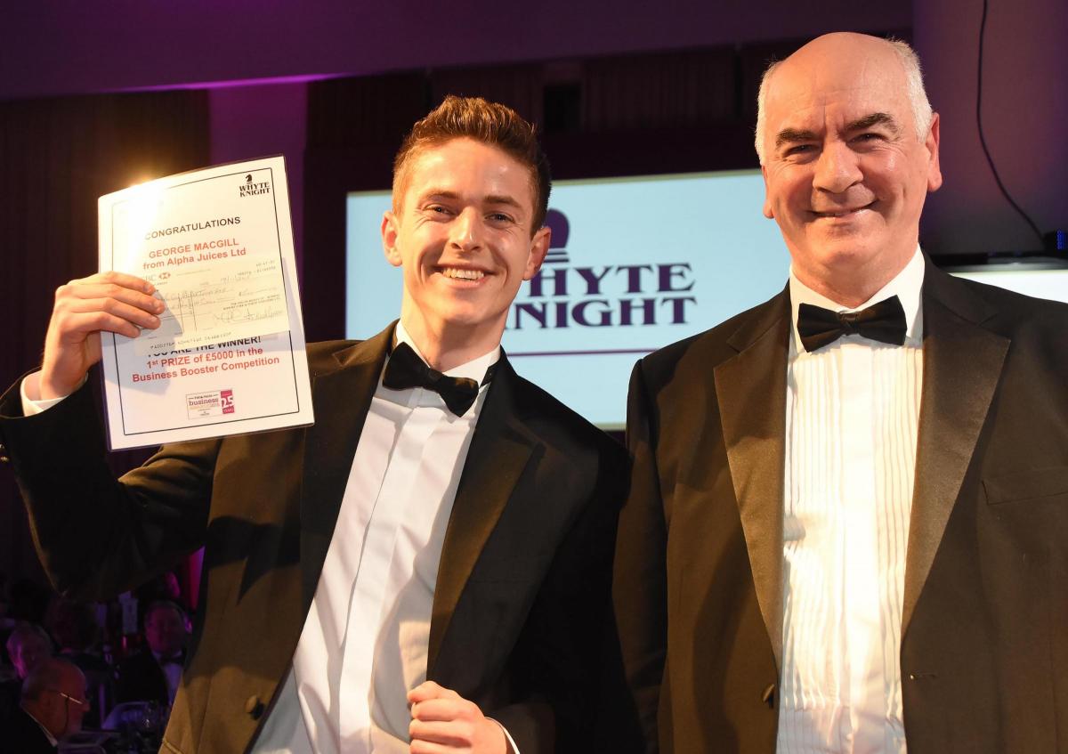 The Press Business Awards 2015. George MacGill recieves a a cheque for £5,000 in the Business Booster competition from Mike Everitt chief executive of BSYNY. Picture David Harrison.
