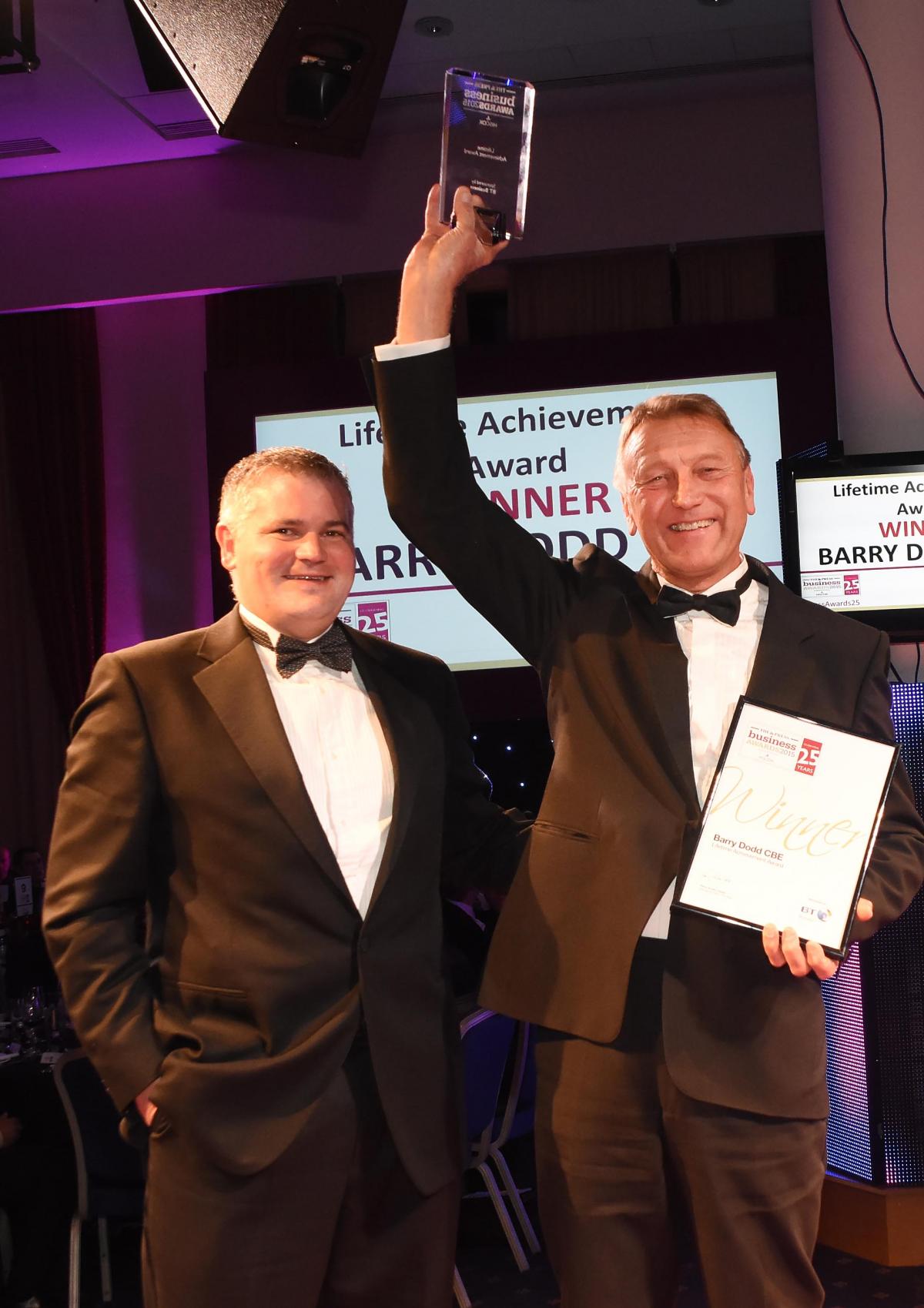 The Press Business Awards 2015. Lifetime Achievement Award Winner Barry Dodd CBE, right, with his award and Danny Longbottom, left, of BT Business who presented the award. Picture David Harrison.