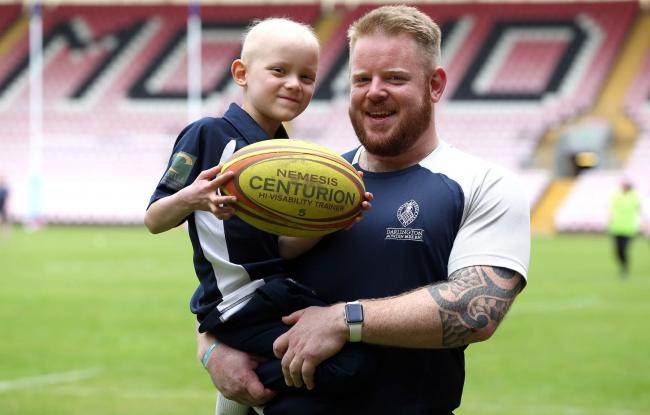 CHALLENGE: A dawn to dusk charity rugby event takes place at The Northern Echo Arena in Darlington in aid of Luke Bell who suffers from the same cancer as Bradley Lowery. Luke and his dad Mark Bell Picture: CHRIS BOOTH
