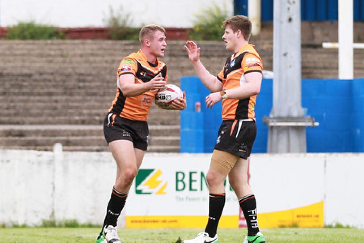 AUGUST STAR: Brad Hey, left, is congratulated by Ben Dent after scoring in York City Knights' match at Barrow Raiders last month. Picture: Gordon Clayton