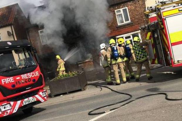 Firefighters tackle the blaze at a house in Thirsk   Picture by Stephen Knowlson
