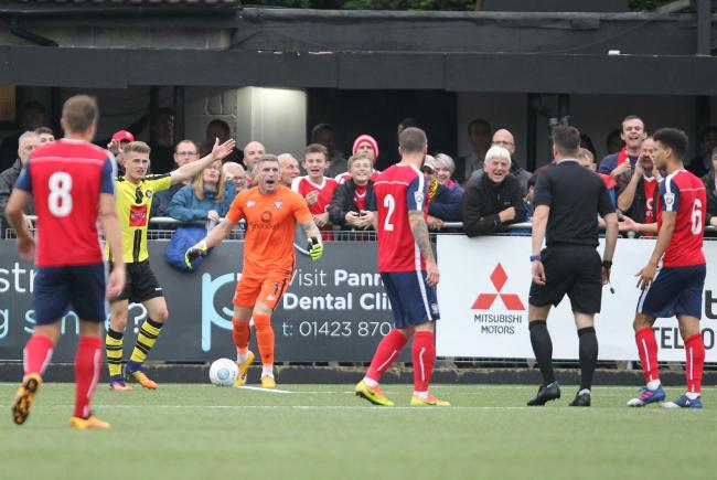 PITCH BATTLE: Former York City keeper Jon Worsnop is pictured after conceding a penalty in last season's 2-0 defeat on Harrogate Town's 3G playing surface. But current boss Sam Collins won't accept that the pitch will play a part in this weeke