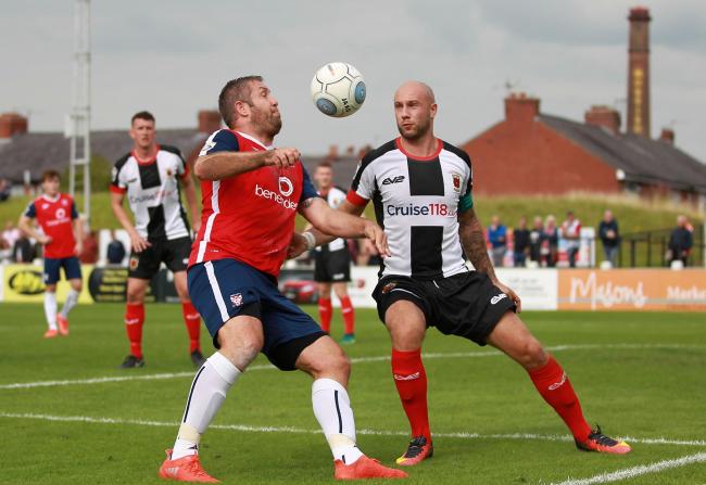 VICTORY QUEST: York City will visit Chorley's Victory Park on the opening day of the National League North season. Jon Parkin is pictured trying to get the better of Magpies captain Andy Teague in the corresponding fixture last September, which finish