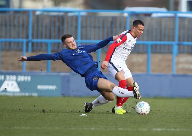 GUEST MOVES ON: Curzon Ashton winger Joe Guest, pictured left tackling former York City defender Connor Brown, has emigrated to Australia, having netted three times in the five pervious meetings between the two clubs