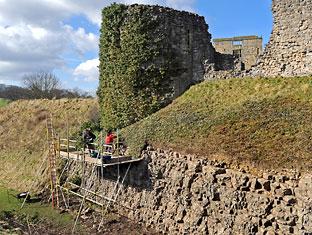 Darren and Fiona Sims working on the foundations and moat of Helmsley Castle. Picture: Matt Clark
