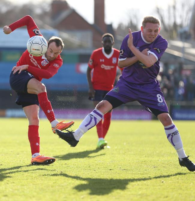 YORKIE BARRED: York City attacker Wes York finds his route towards the Altrincham goal blocked by man-of-the-match Sean Williams. Picture: Gordon Clayton
